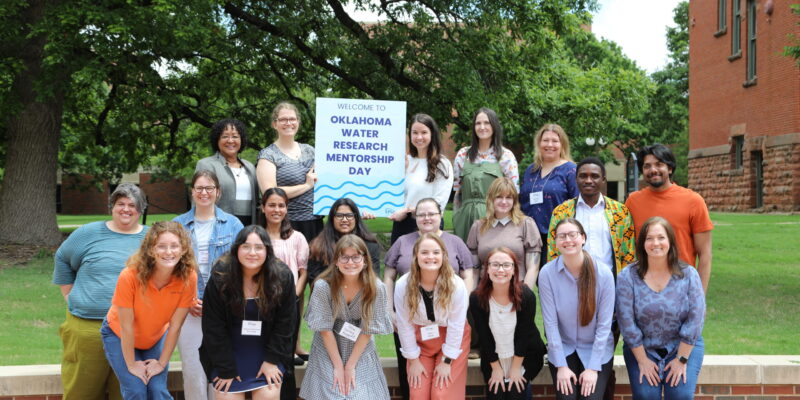 Group of students posing for photo with sign reading Welcome to Oklahoma Water Research Mentorship Day.