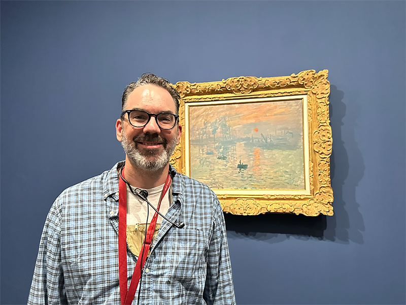 Dr. James Ford, professor and interim department head for English and Humanities, admires a painting at the Musee d’Orsay (Museum in Paris) while traveling with the RSU studies-at-large group.