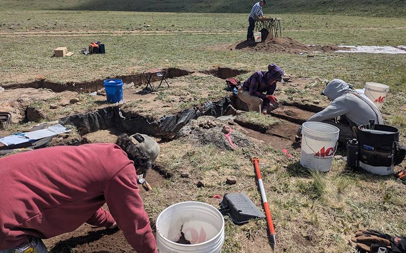 Members of the research team collect samples for eDNA analysis. Care must be taken to not contaminate the samples with modern DNA.