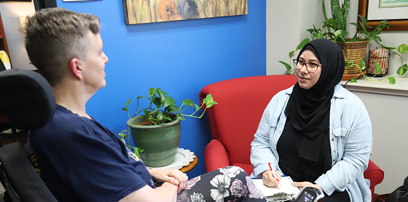 Woman counseling another woman.