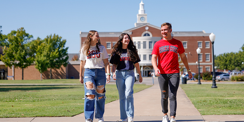 Students walking in front of library