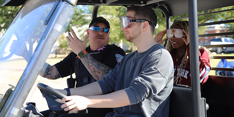 driving an atv with drunk driving simulator goggles