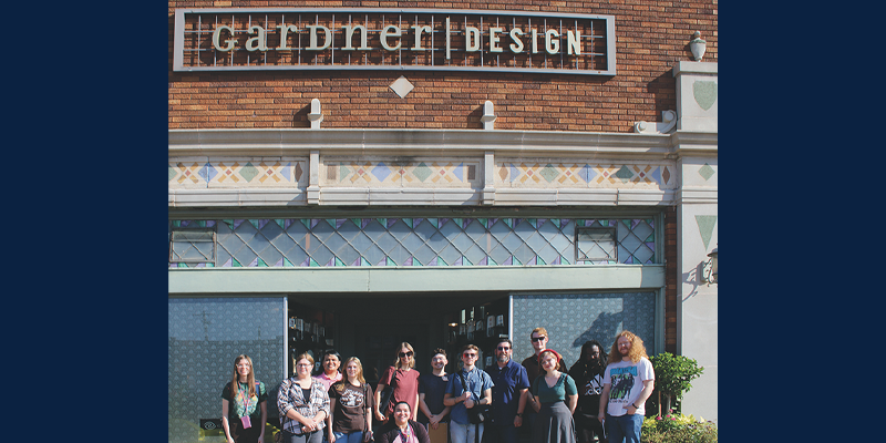 Group of students standing in front of Gardner Design firm.