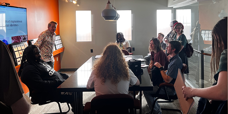 Group of students touring Gardner Design firm.