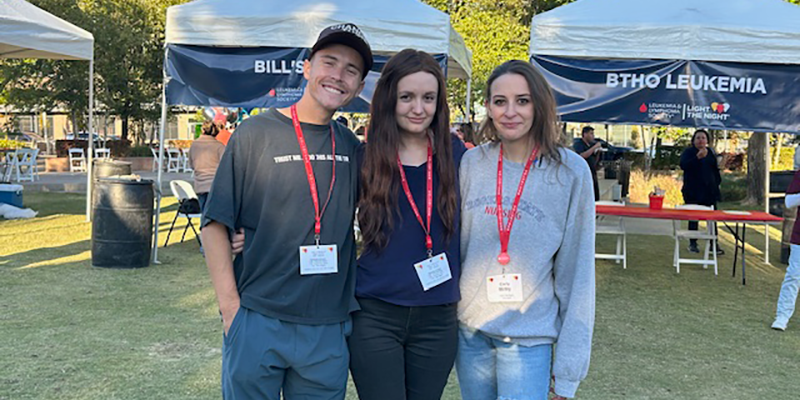 man and two women standing for photo