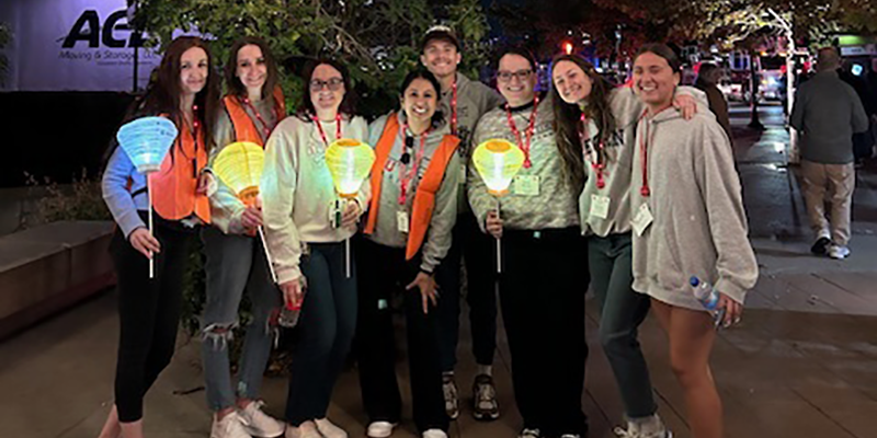 group photo of young ladies holding lanterns