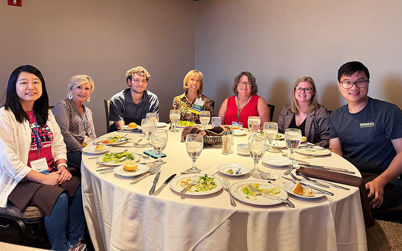 Group seated at banquet table.