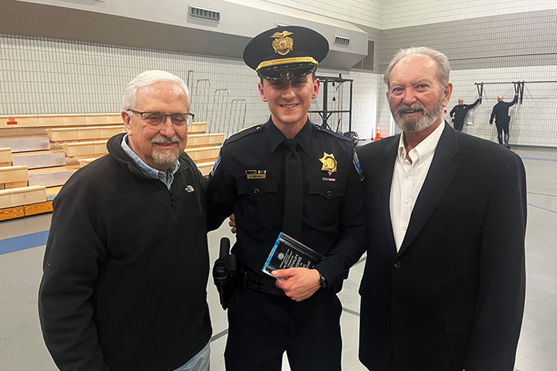 RSU Assistant Professor Gerry Bender (left) and Assistant Professor Rob Turner (right) congratulate RSU alumnus Hunter Bowen (center) for the recent completion of his training at the Tulsa Police Academy. Collinsville native Bowen finished his training with top scholar honors.