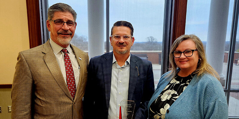 Dr. Curtis Sparling (center) with Dr. Mark Rasor (left) and Dr. Cathy Sparling (right)