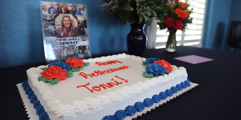 A cake with white frosting on a table