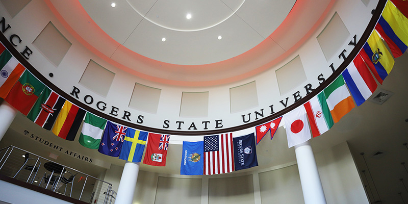 Flags representing the home nations of RSU's international student population hang in the DCTC rotunda.